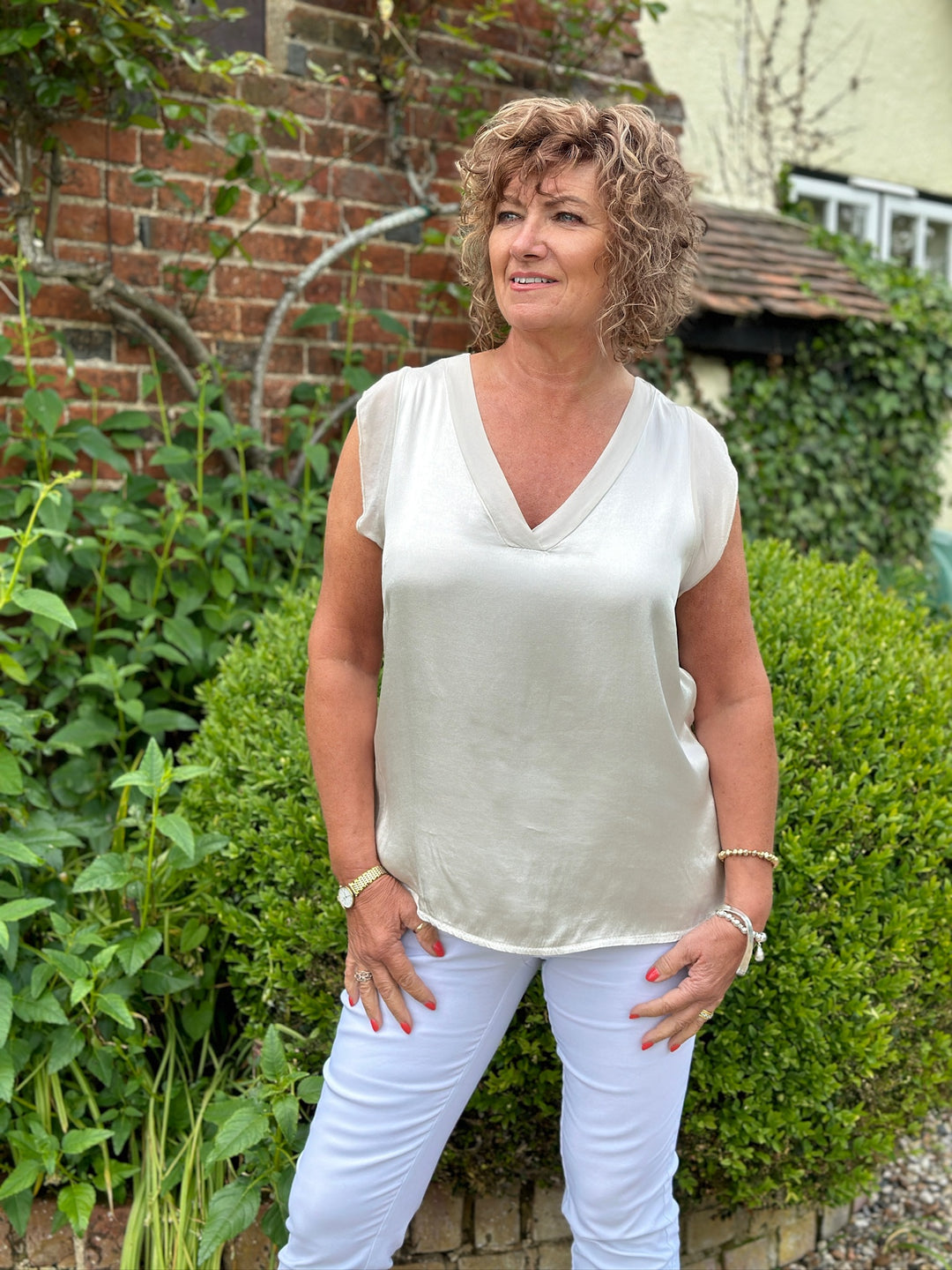 Sleeveless V-Neck Frill Hem Blouse | Beige